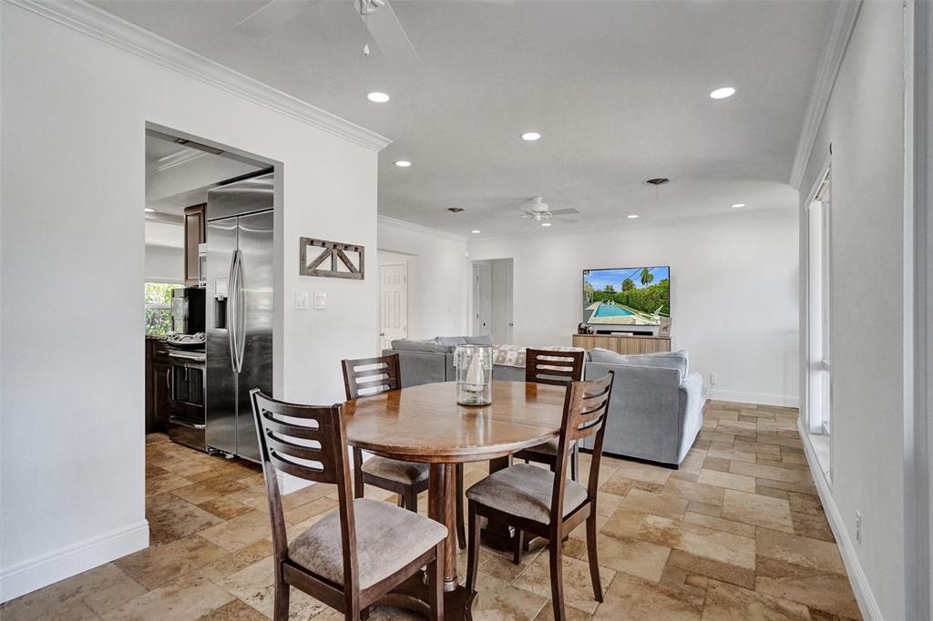 2185 Northeast 61st Court Fort Lauderdale, FL 33308 - Photo 6 of 49 a view of a dining room with furniture
