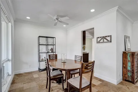a view of a dining room with furniture and window