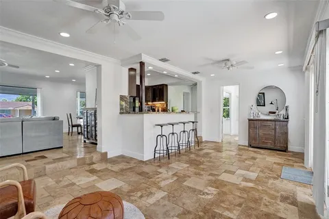 a view of a kitchen with furniture and a living room