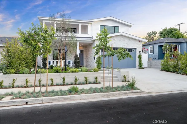 front view of a house with a garden
