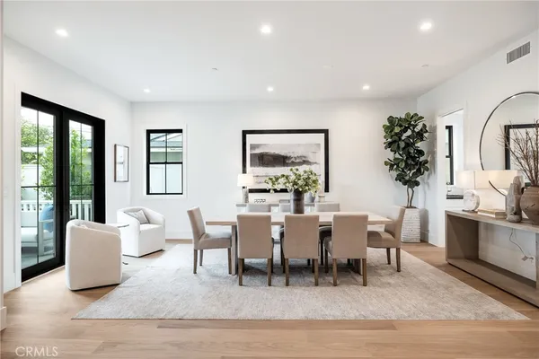 a living room with furniture potted plant and a window