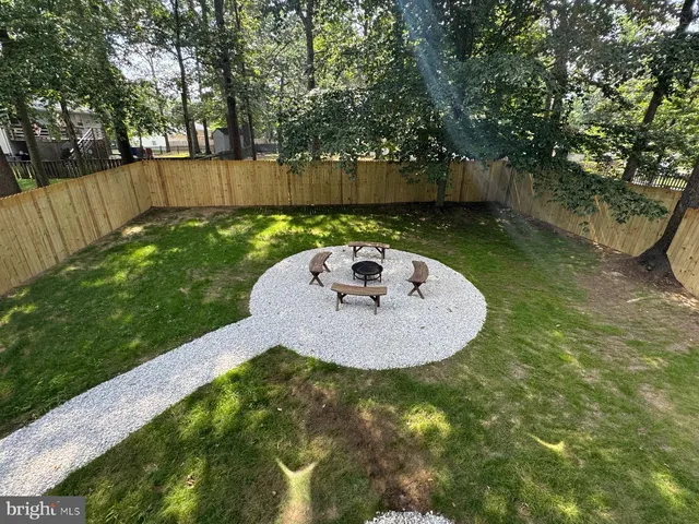 a view of a swimming pool with a yard