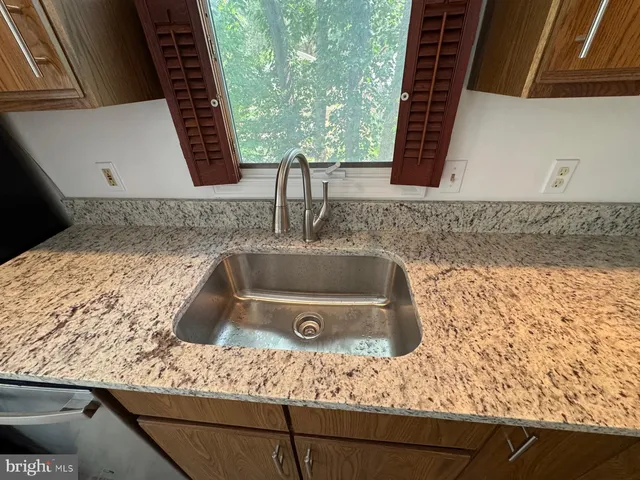 a kitchen with sink and window