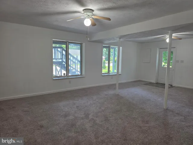 en empty room with windows