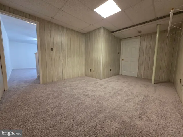 a kitchen with sink and refrigerator