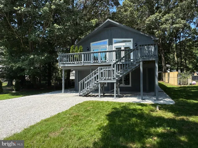 a view of house with a yard