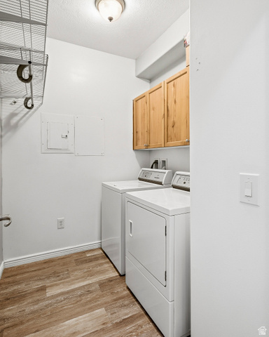1177 Northfield Road, Unit 26 Cedar City, UT 84721 - Photo 16 of 45 Dedicated laundry area featuring wood-finish flooring and integrated cabinetry