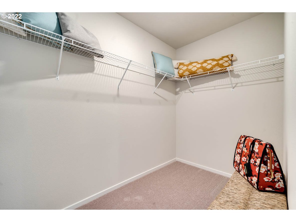 2966 V Street Springfield, OR 97477 - Photo 18 of 18 a view of a closet area with racks on the wall