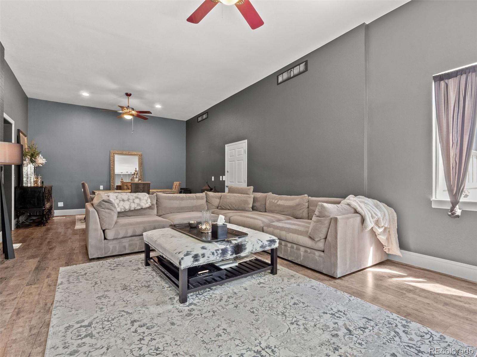 6595 West 46th Place Wheat Ridge, CO 80033 - Photo 12 of 48 a living room with furniture and a rug