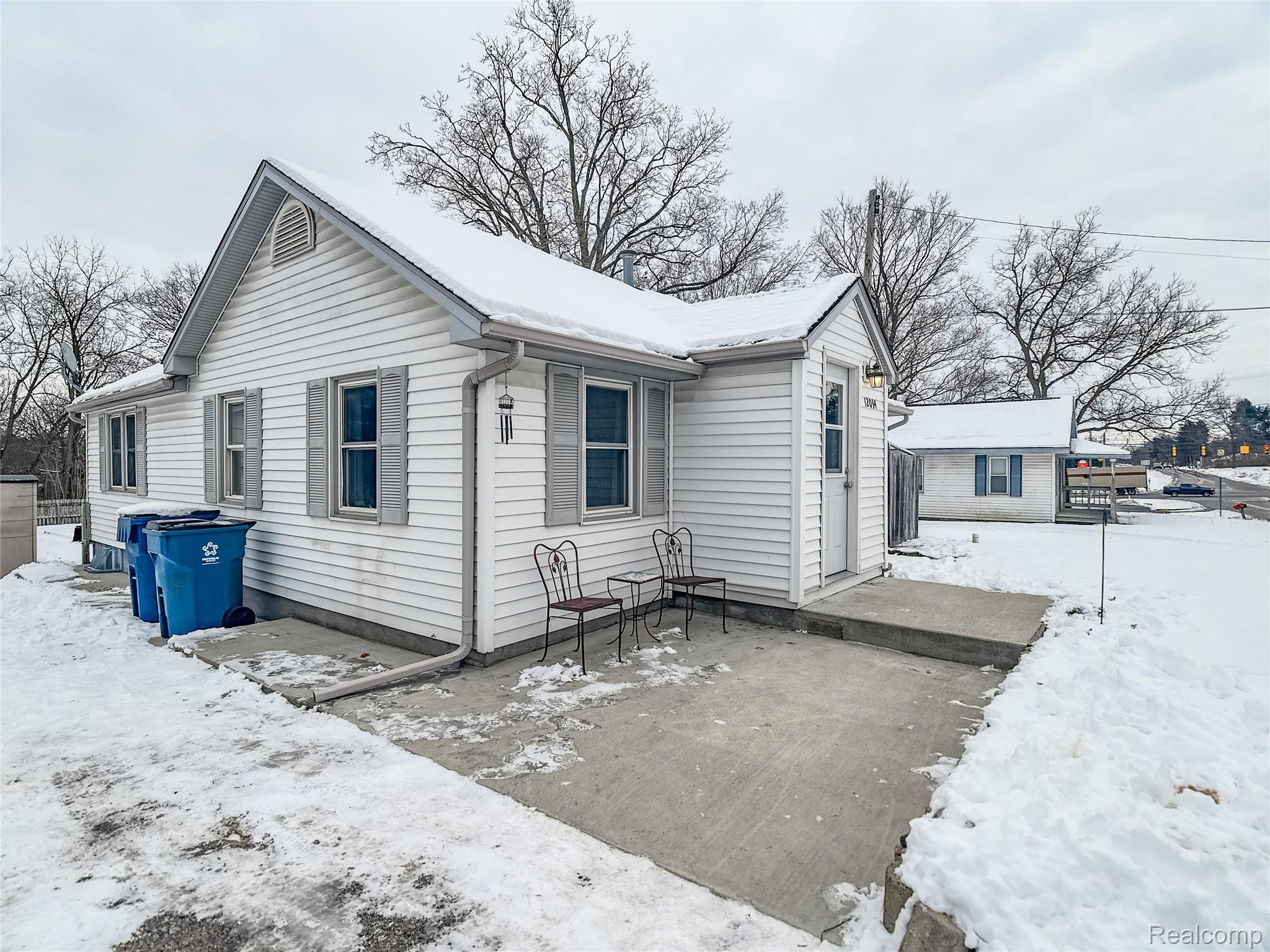 12034 North Seymour Road Montrose, MI 48457 - Photo 52 of 56 View of snowy exterior with a patio area