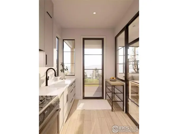 a kitchen with stainless steel appliances kitchen island a table chairs in it and wooden floors