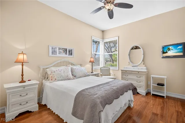 a bathroom with a granite countertop sink a toilet and mirror