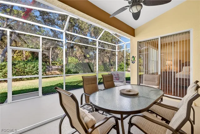 a view of a house with a yard and potted plants
