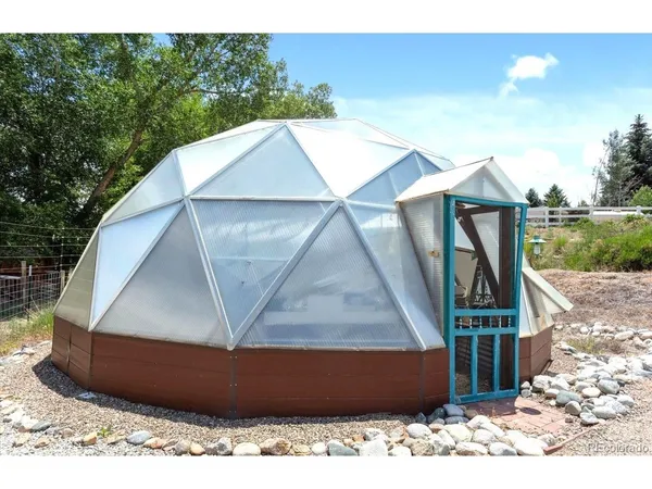 a view of a building with sitting area