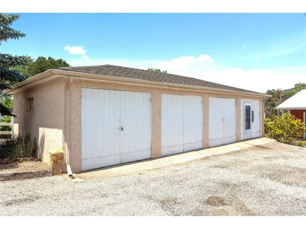 a picture of a room with a white wall and a picture of it