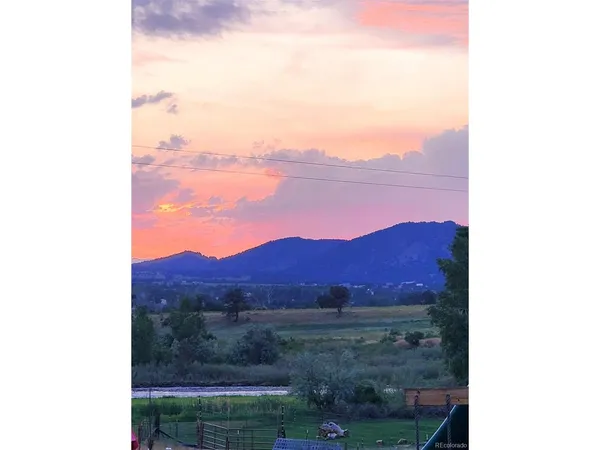 a view of mountains and valleys in the background