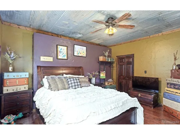 a bed room with a bed and a television