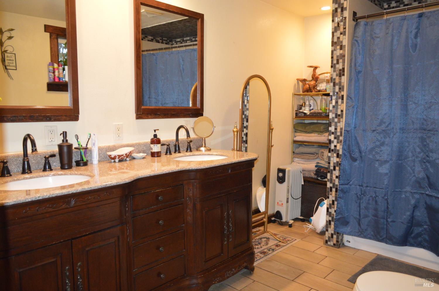 230 Shell Lane Willits, CA 95490 - Photo 19 of 32 a bathroom with a sink and mirror