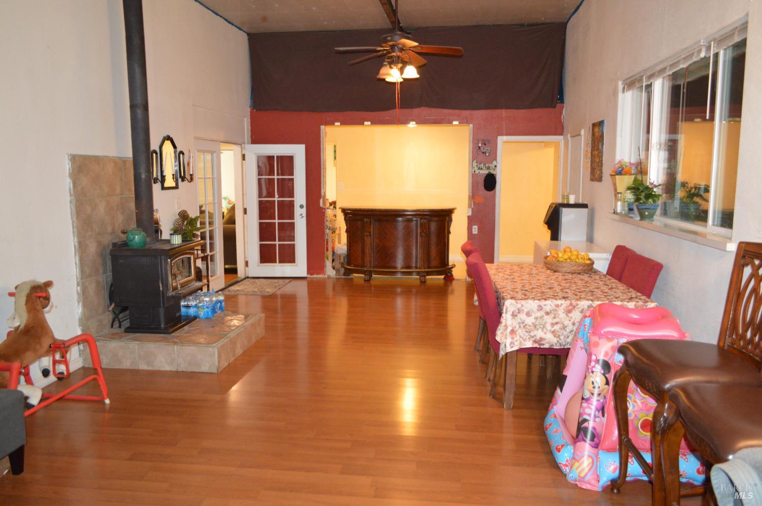 230 Shell Lane Willits, CA 95490 - Photo 25 of 32 a living room with furniture fireplace and large windows