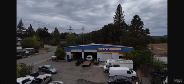 a view of a patio in front of retail shops