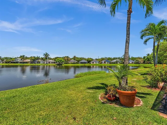 a view of a lake with couches and city view