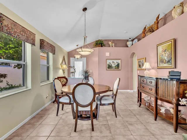 a dining room with furniture and window