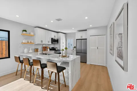 a view of a dining area with furniture and wooden floor
