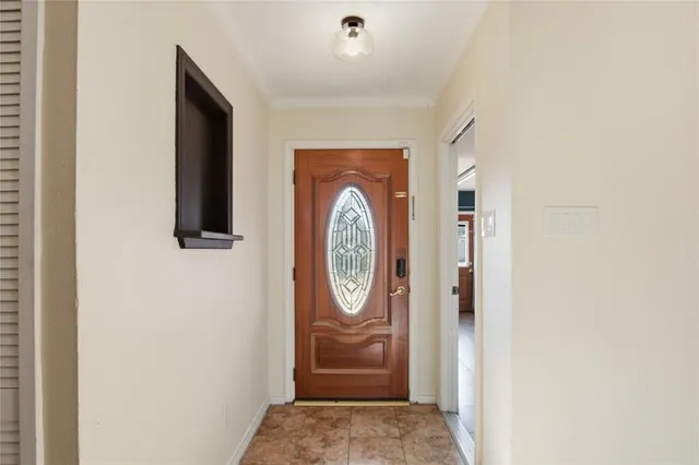 a front view of a house with entrance gate