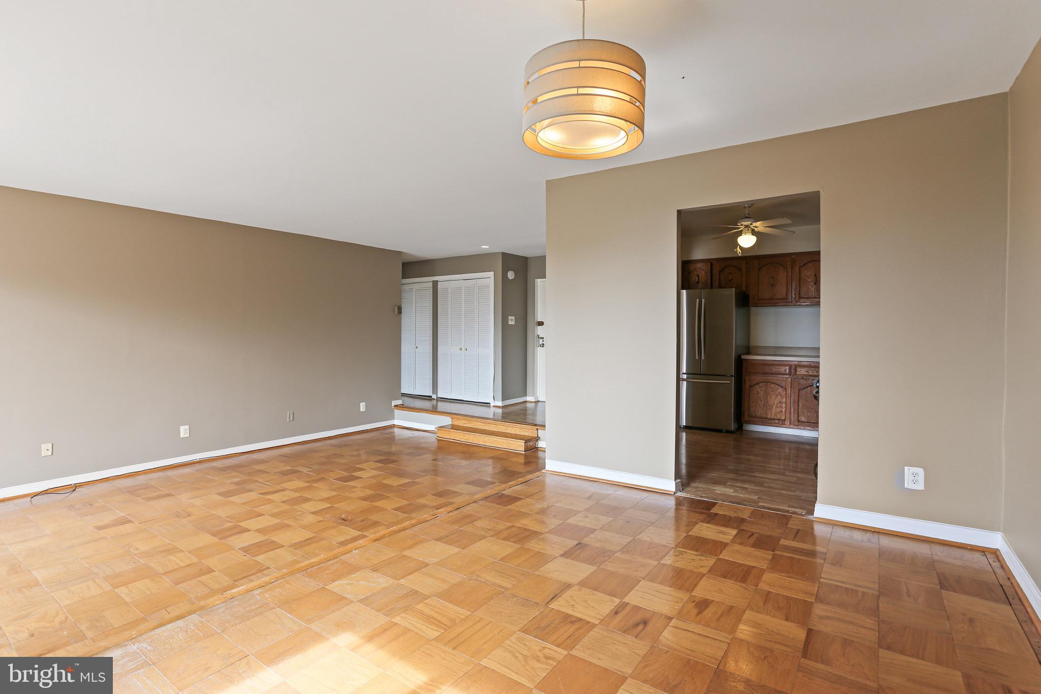 9900 Georgia Avenue, Unit 27708 Silver Spring, MD 20902 - Photo 12 of 32 Dining Room Leading to the Kitchen and Living