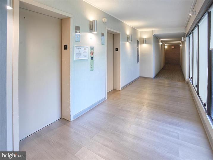 9900 Georgia Avenue, Unit 27708 Silver Spring, MD 20902 - Photo 27 of 32 Hallway off of the Elevator leading to the Condo