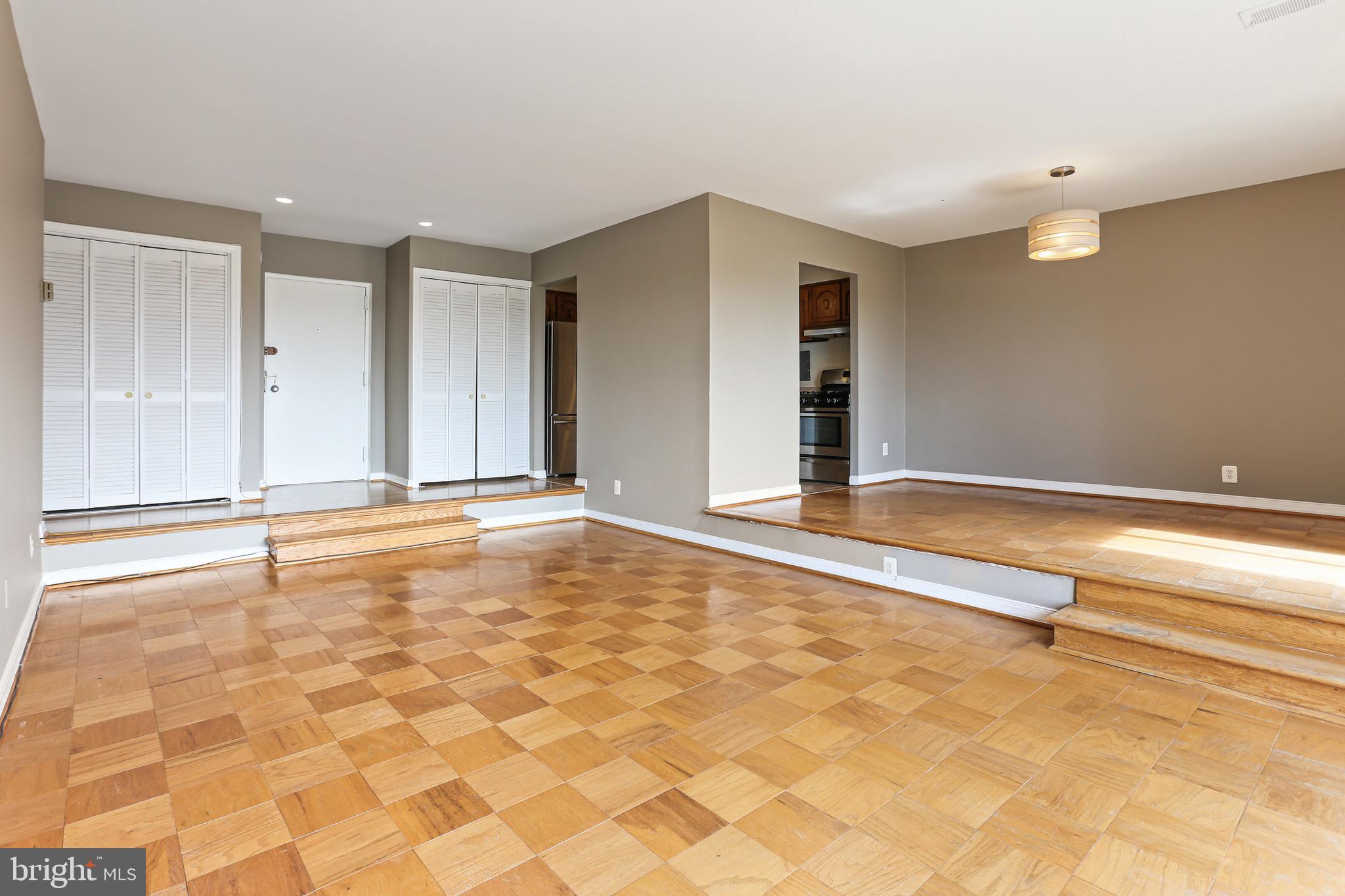 9900 Georgia Avenue, Unit 27708 Silver Spring, MD 20902 - Photo 10 of 32 Foyer with Step Down into the Living Room