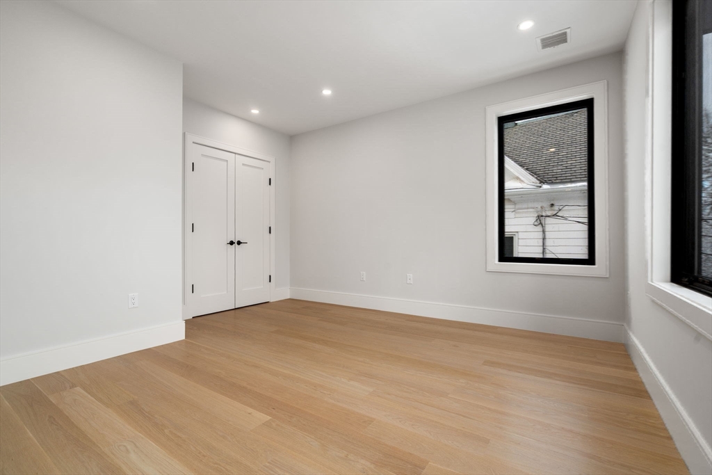 116 Thorndike Street, Unit 2B Brookline, MA 02446 - Photo 19 of 33 a view of an empty room with a window
