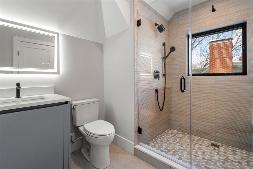116 Thorndike Street, Unit 2B Brookline, MA 02446 - Photo 20 of 33 a bathroom with a toilet sink and shower