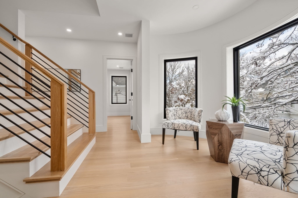 116 Thorndike Street, Unit 2B Brookline, MA 02446 - Photo 2 of 33 a living room with furniture and a window