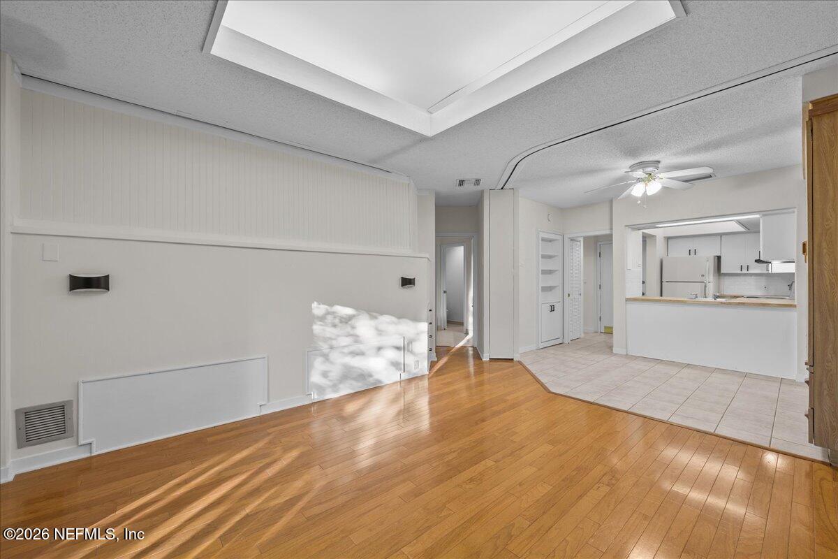 2990 Ravines Road, Unit 1422 Middleburg, FL 32068 - Photo 11 of 20 a view of empty room with wooden floor