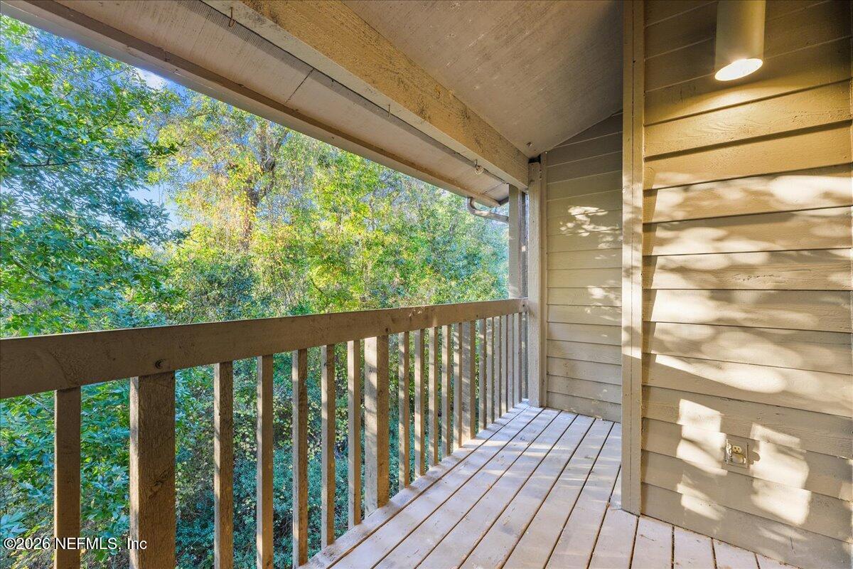 2990 Ravines Road, Unit 1422 Middleburg, FL 32068 - Photo 12 of 20 a view of balcony with wooden floor