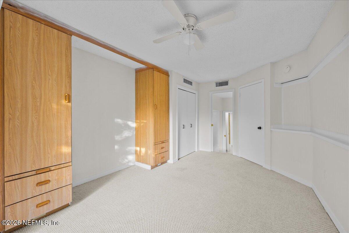 2990 Ravines Road, Unit 1422 Middleburg, FL 32068 - Photo 18 of 20 a view of a big room with closet and windows