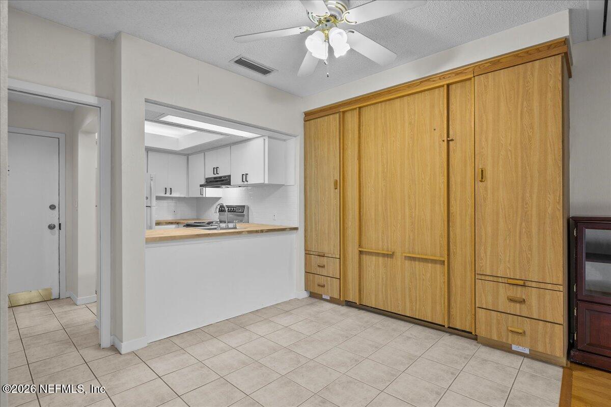 2990 Ravines Road, Unit 1422 Middleburg, FL 32068 - Photo 7 of 20 a view of a kitchen with closet area