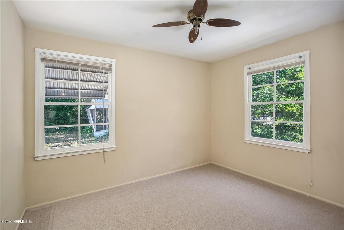 1742 Planters Road Jacksonville, FL 32207 - Photo 11 of 18 a view of an empty room with a window