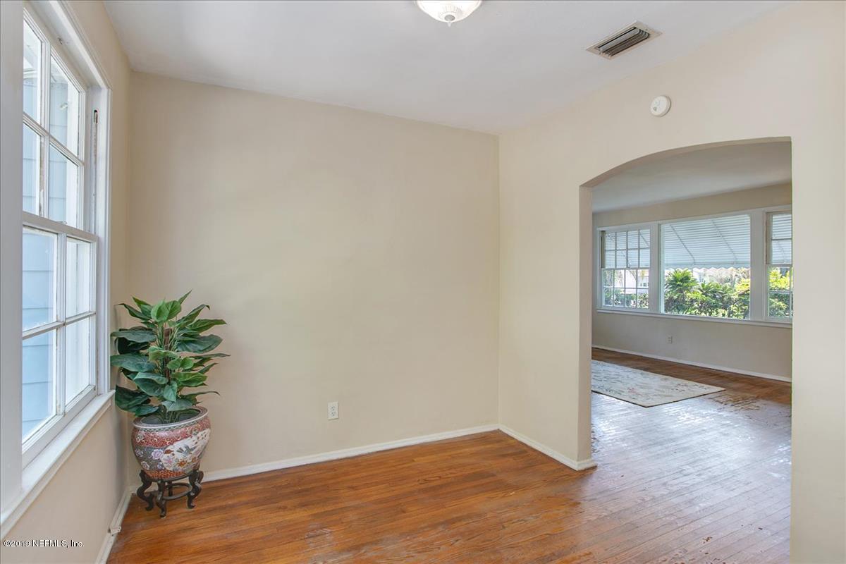 1742 Planters Road Jacksonville, FL 32207 - Photo 7 of 18 an empty room with potted plants and wooden floor