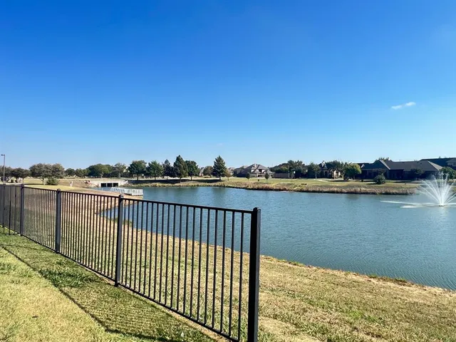 a view of a lake from a balcony