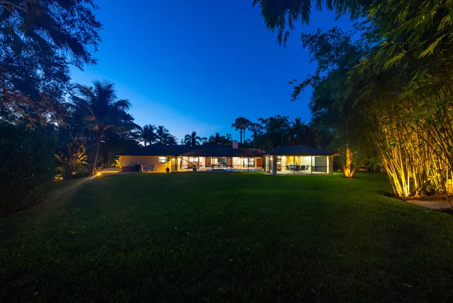 a view of swimming pool with seating area and furniture