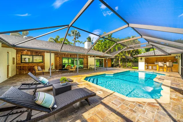 a view of a swimming pool with a patio