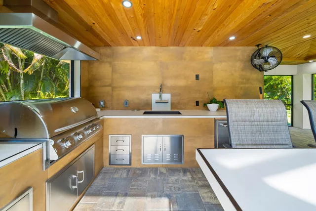 a dining area with furniture and a kitchen view