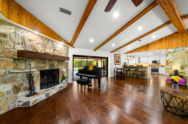a kitchen with sink a stove and cabinets