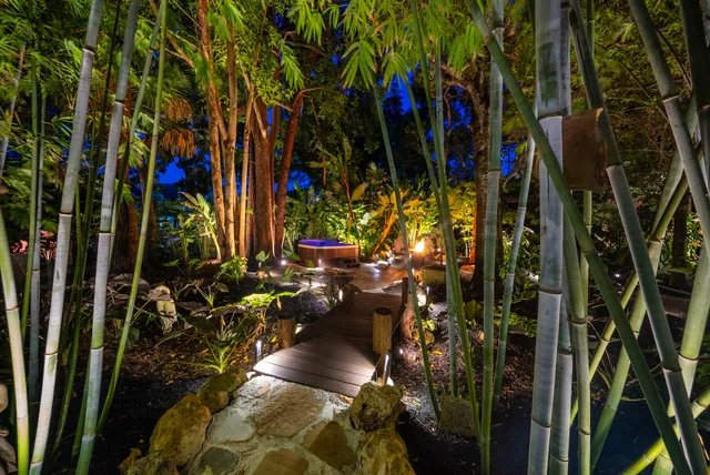 a view of a backyard with sitting area