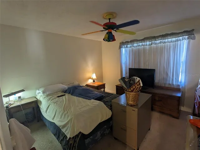 a bed room with furniture and a window