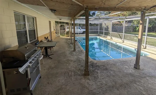 a view of a room with wooden floor and iron stairs