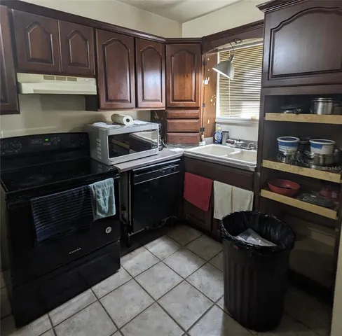 a kitchen with stainless steel appliances granite countertop a stove and a sink