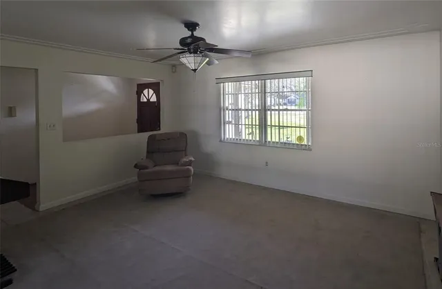 a living room with furniture and a window